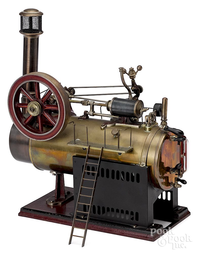 Appraisal: Brass and cast iron live steam horizontal boiler Doll brass