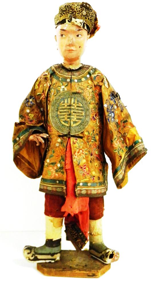 Appraisal: Early papier mache Oriental doll '' h with traditional costume