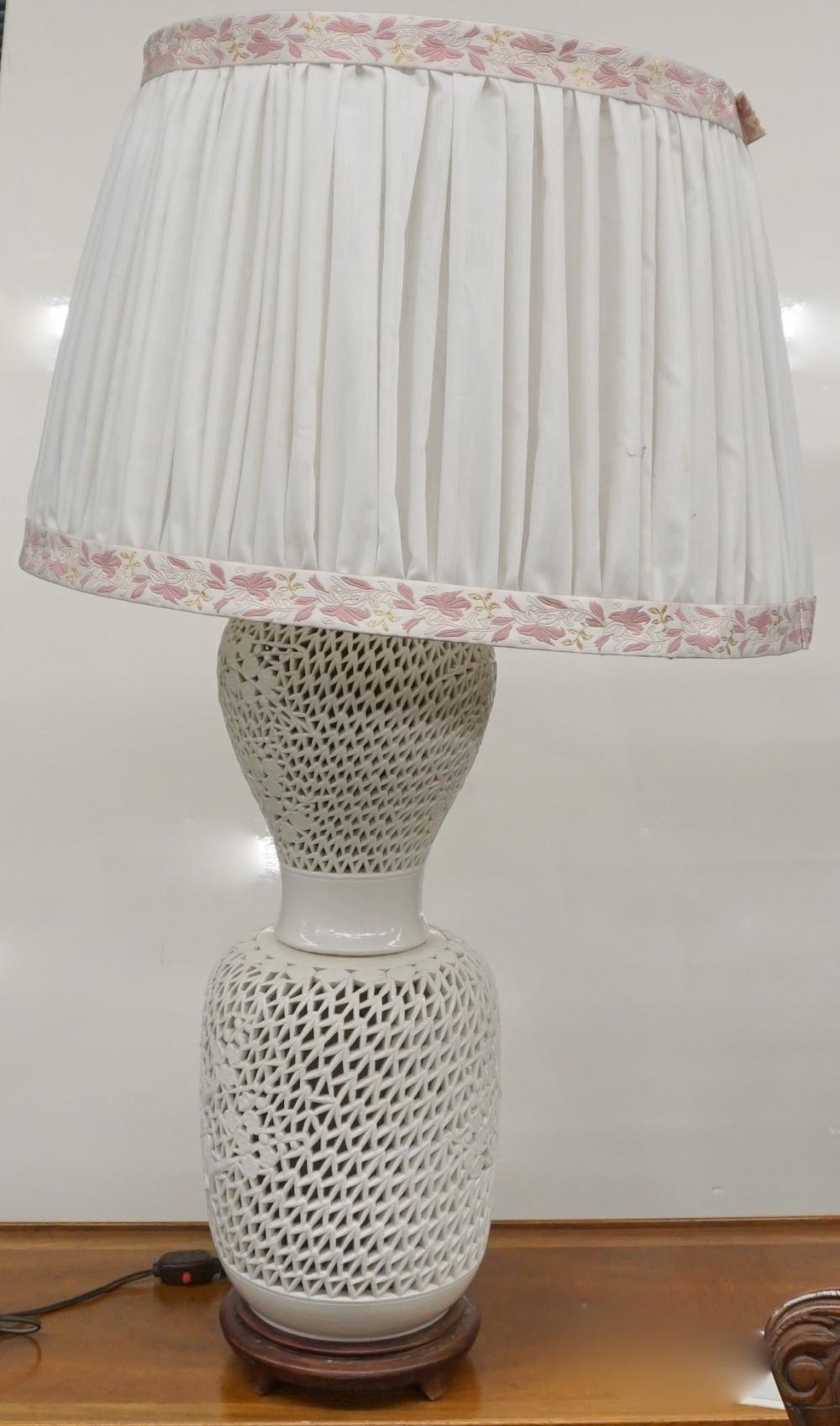 Appraisal: TWO CHINESE BLANC DE CHINE PIERCED PORCELAIN BASE TABLE LAMPS