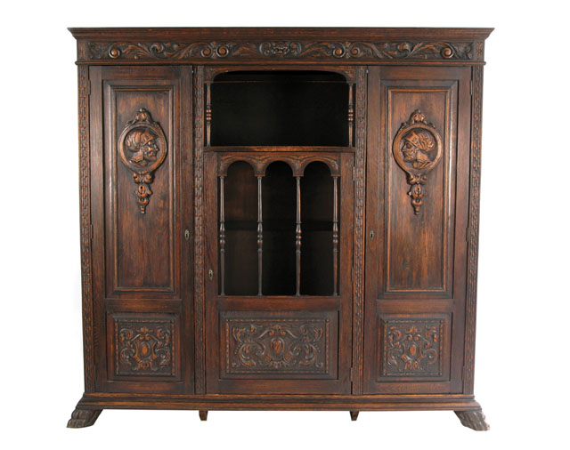 Appraisal: LARGE CARVED OAK CABINET BOOKCASE Italian Renaissance Revival style Continental