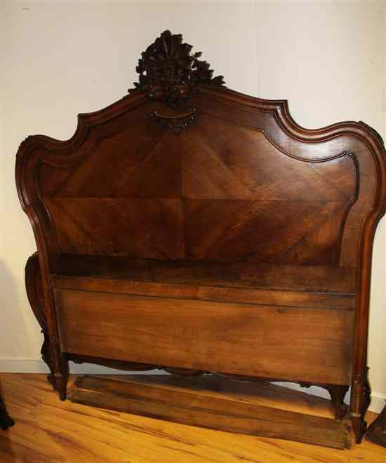 Appraisal: A th century French walnut bedstead with scroll carved frame