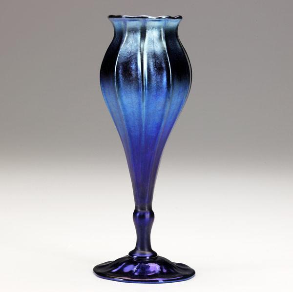 Appraisal: TIFFANY STUDIOS Blue Favrile glass ribbed bud vase Etched K