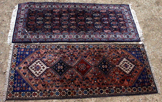 Appraisal: TWO TH CENTURY CARPET RUNNERS both with geometric patterns on