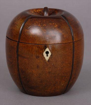 Appraisal: GEORGE III FRUITWOOD APPLE-FORM TEA CADDY With vertical grooves and