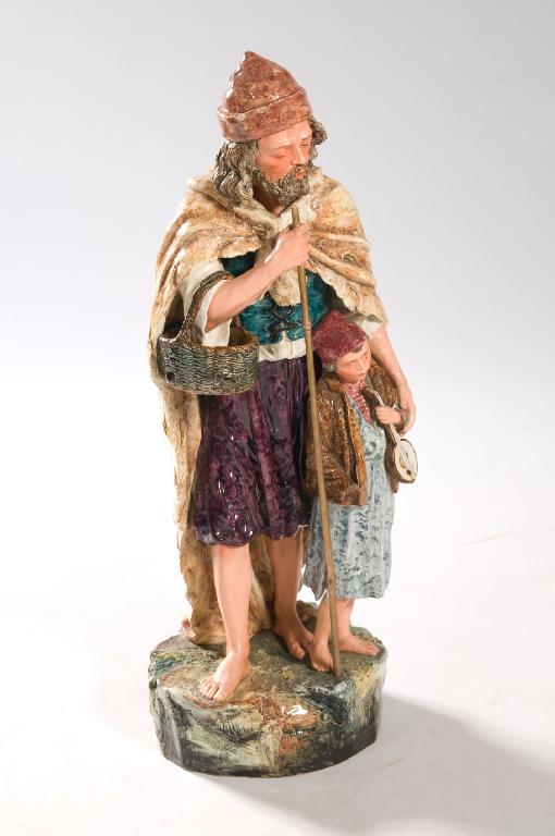 Appraisal: CONTINENTAL MAJOLICA FIGURE GROUP LATE th CENTURY OF A BEGGAR