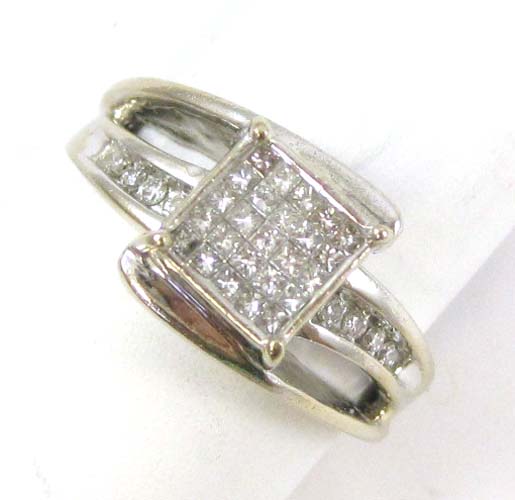 Appraisal: DIAMOND AND TEN KARAT WHITE GOLD RING set with eight