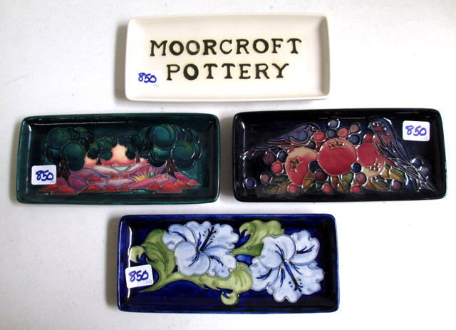 Appraisal: FOUR MOORCROFT POTTERY TRAYS hand painted under glaze in the