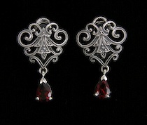 Appraisal: A Pair Of Ladies' Sterling Silver And Garnet Earrings A