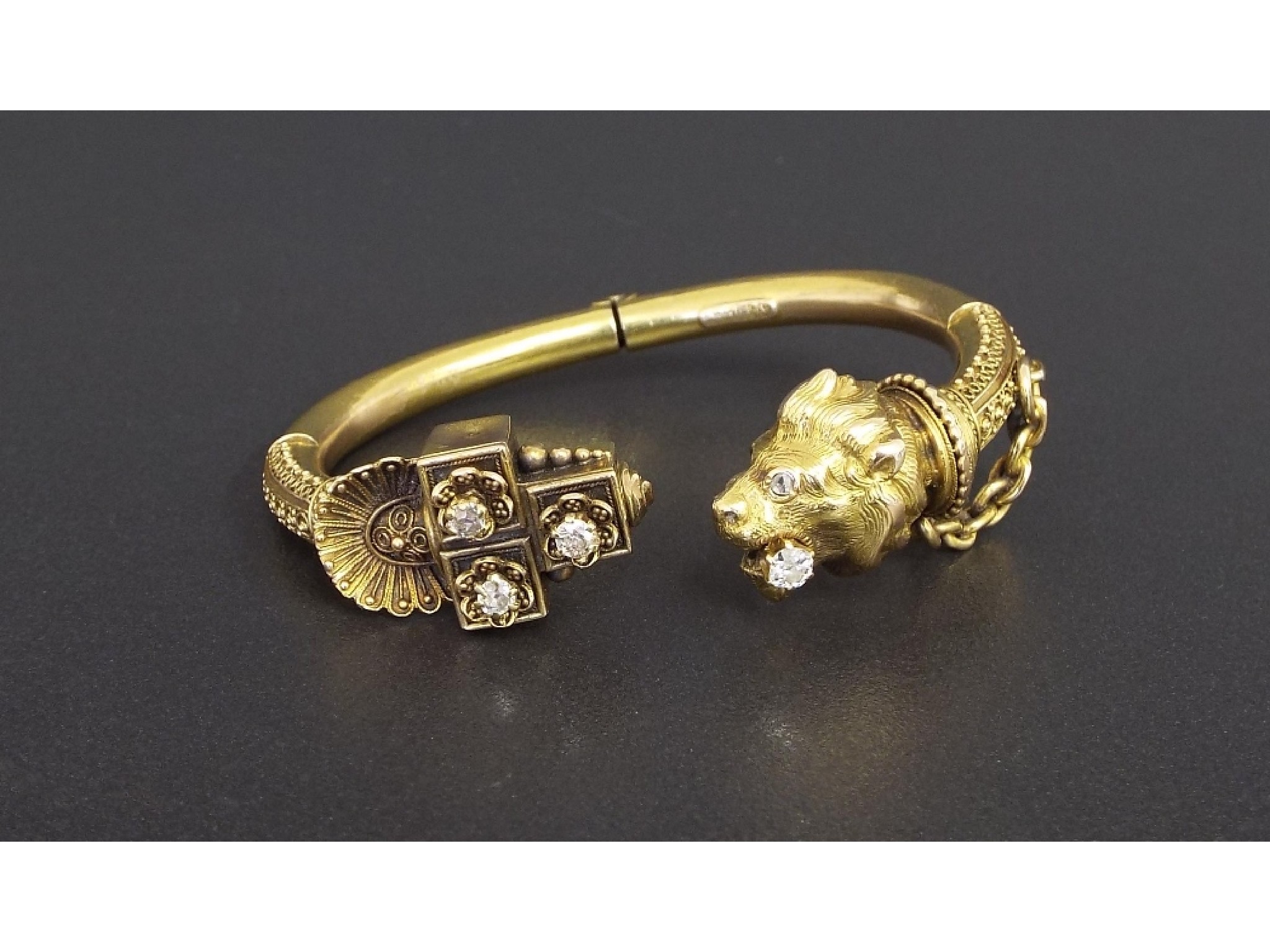 Appraisal: Attractive gilt spring hinge bangle set with five old-cushion-cut diamonds