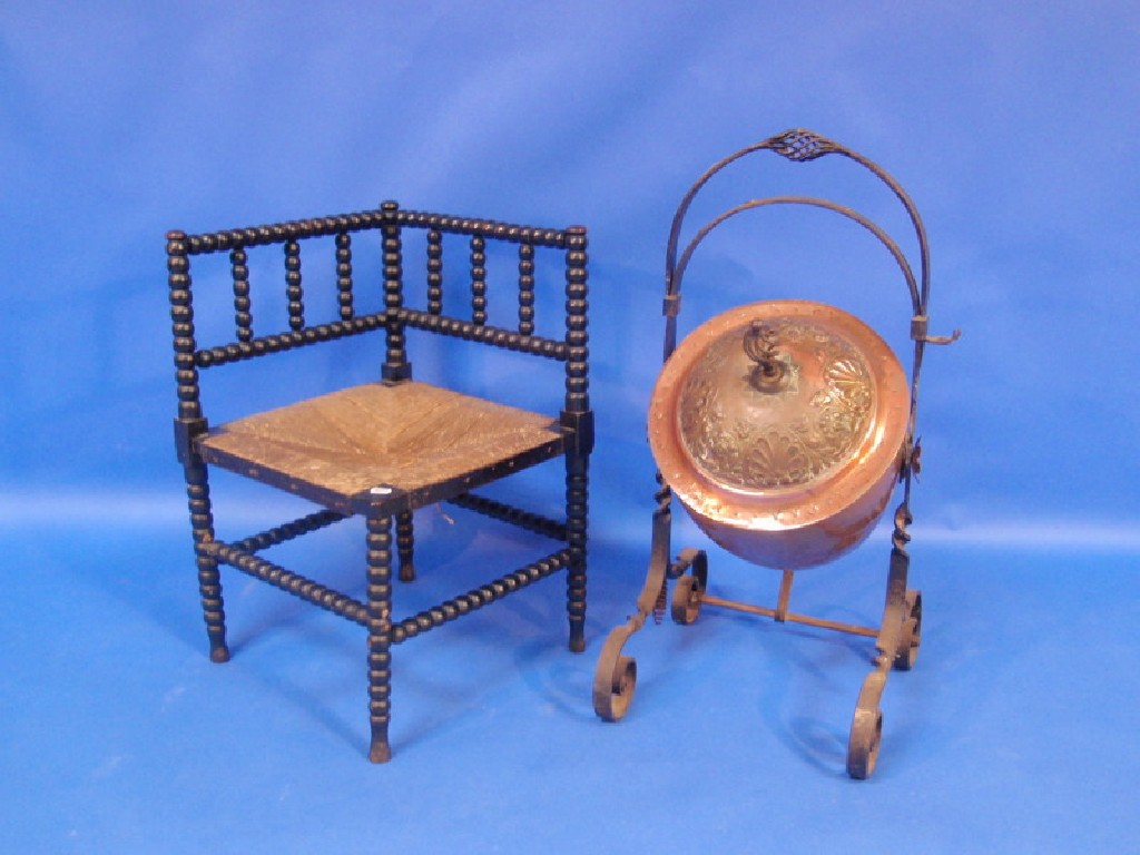 Appraisal: An Arts and Crafts copper coal scuttle and a Victorian