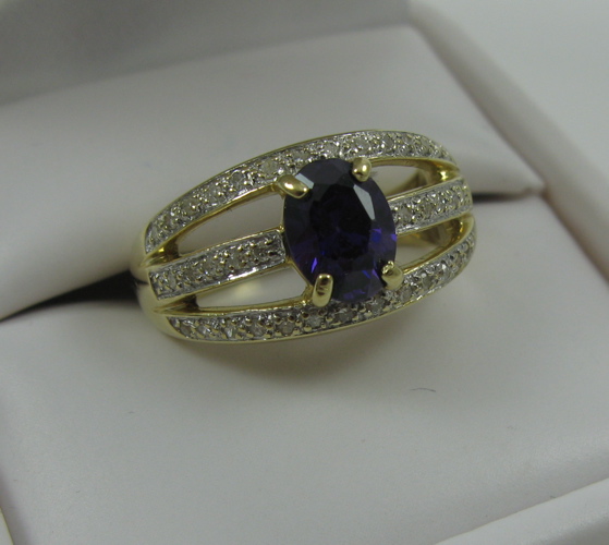 Appraisal: AMETHYST AND DIAMOND RING with K yellow gold pierced shank