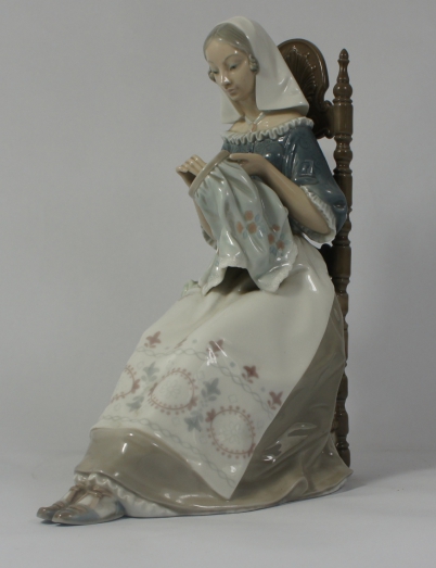 Appraisal: Lladro large figure of a Woman seated on chair doing