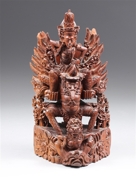 Appraisal: Indonesian carved wood statue depicting a figure mounted on a