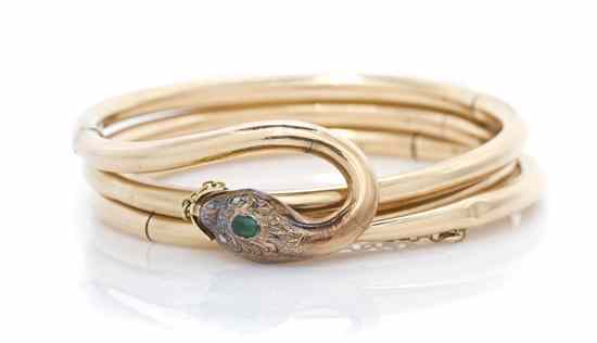 Appraisal: A Victorian Yellow Gold Emerald and Diamond Serpent Bracelet containing