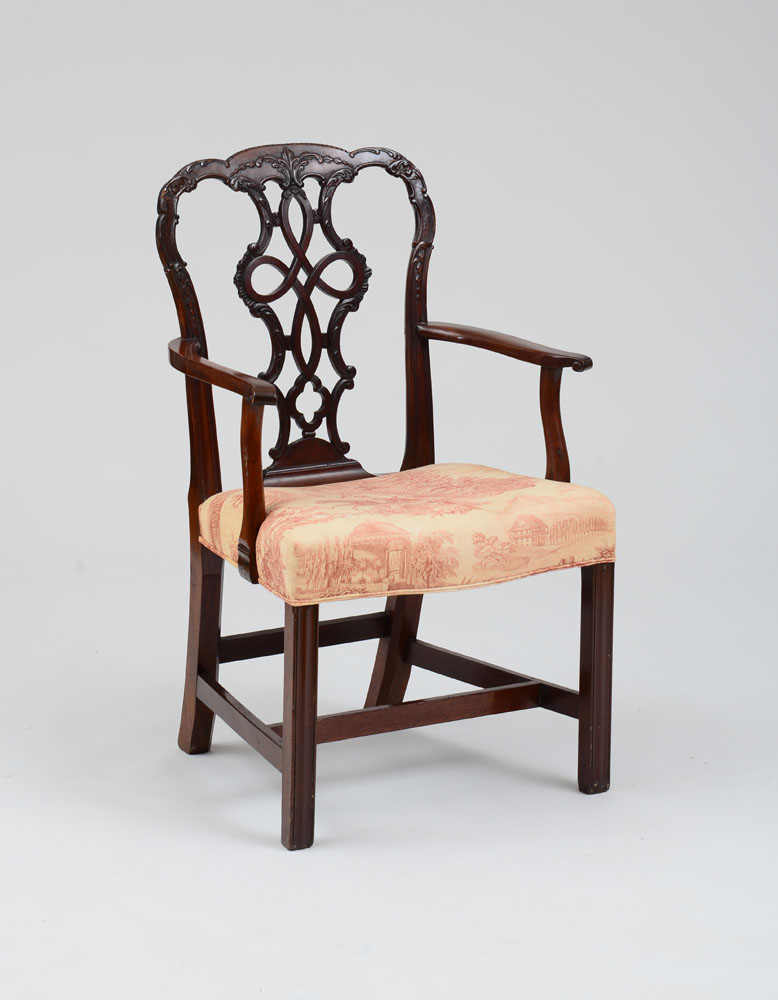 Appraisal: GEORGE III CARVED MAHOGANY ARMCHAIR With an undulating top rail