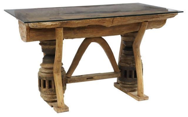 Appraisal: Rustic table th c having thick rectangular glass top resting