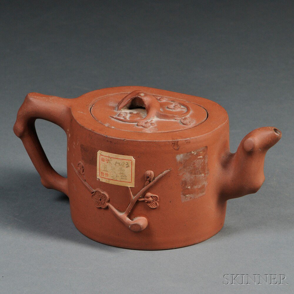 Appraisal: Yixing Teapot China th century irregular shape with branch form