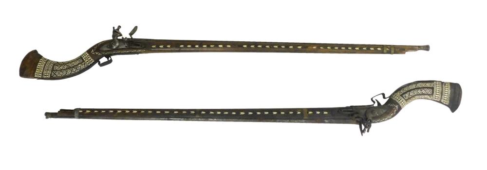 Appraisal: Pair of th C Moroccan Camel Rifles simplistic workmanship with