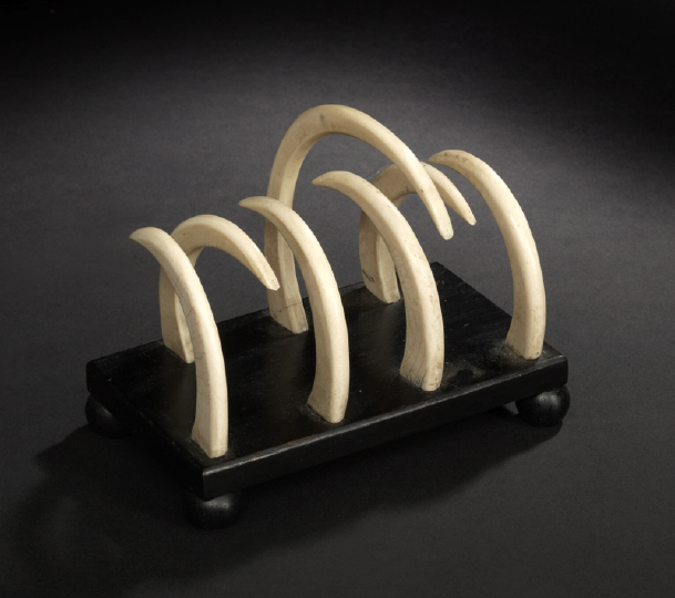 Appraisal: Exotic Anglo-Indian Tusk and Black-Painted Oblong Stationery Rack fourth quarter