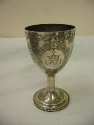 Appraisal: A VICTORIAN GOBLET the ovoid bowl chased with scrolling foliage