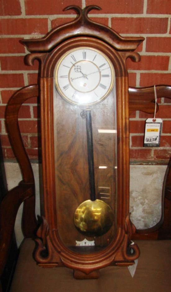 Appraisal: Vienna walnut regular wall clock circa stylized molded crown over