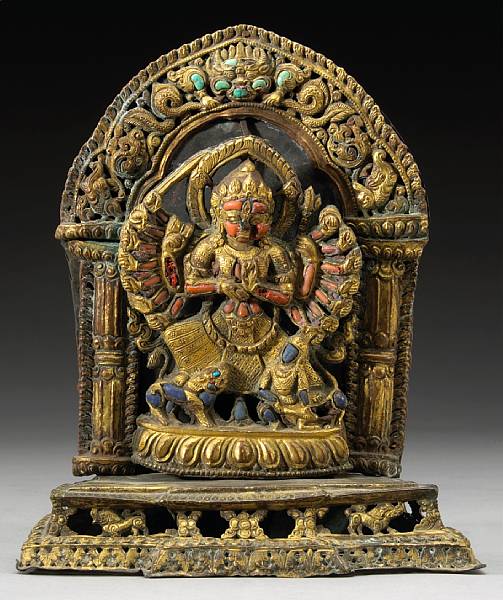 Appraisal: A gilt copper and inlaid figure of Durga Mahisha mardini