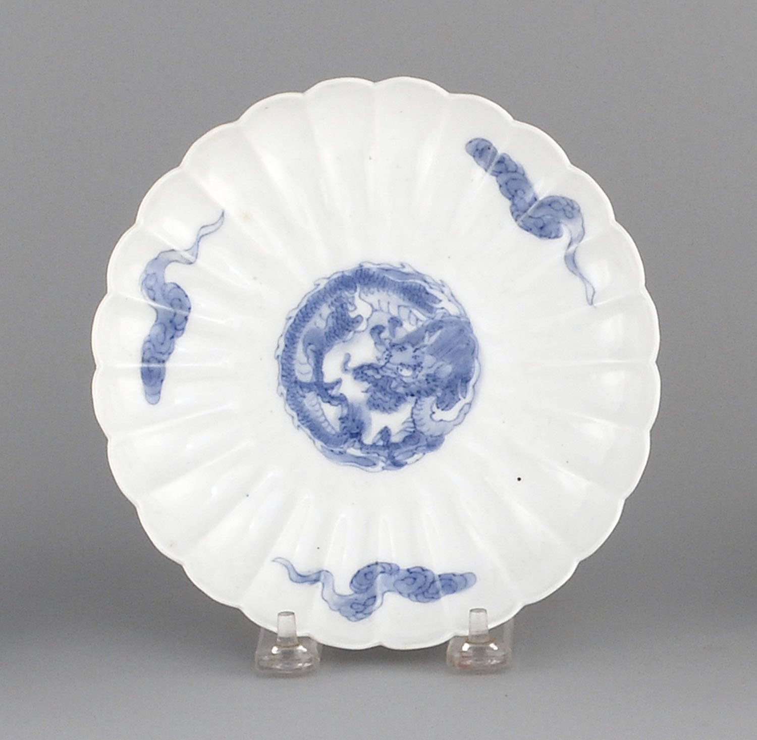 Appraisal: HIRADO PORCELAIN PLATE Circa In flower form with dragon and