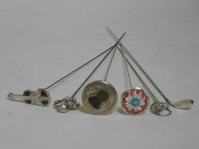 Appraisal: A COLLECTION OF FOUR SILVER HATPINS including a golf club