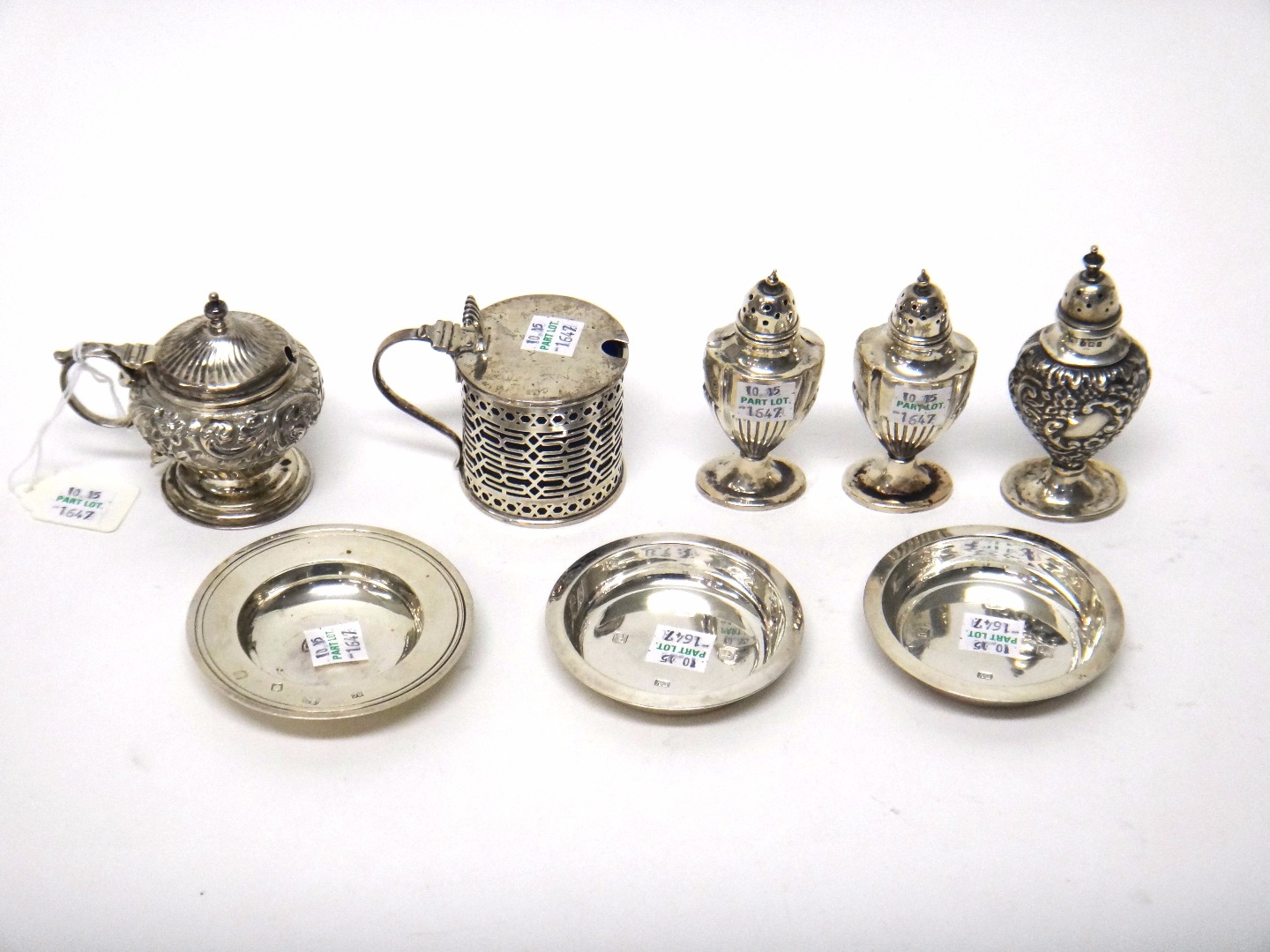 Appraisal: Silver comprising a cylindrical mustard pot having pierced decoration Chester