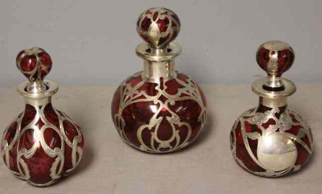 Appraisal: STERLING Cranberry Silver Overlay Lot Includes a bulbous decanter -