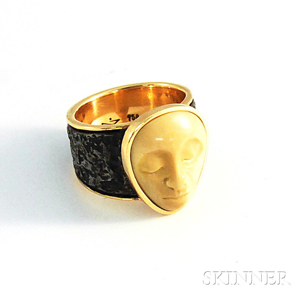 Appraisal: kt Gold Metal and Carved Stone Ring approx size dwt