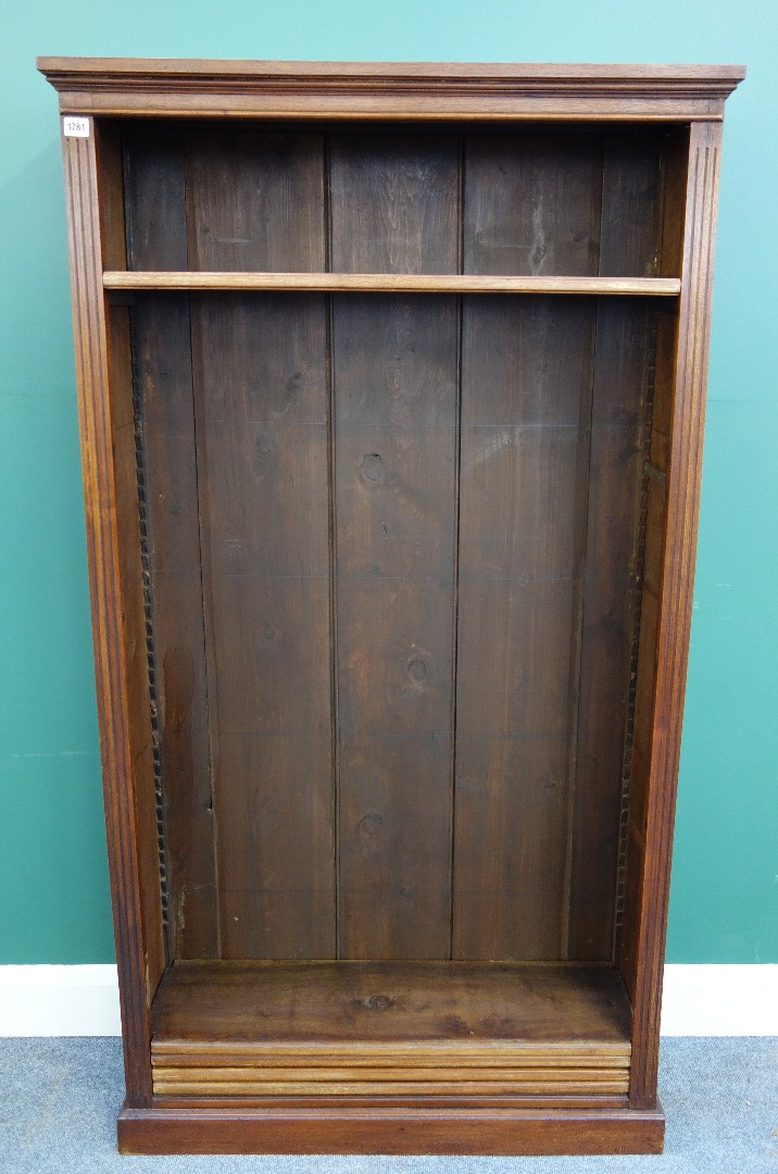 Appraisal: A walnut floor standing open bookcase on plinth base cm