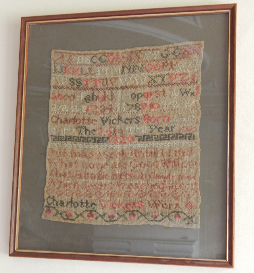 Appraisal: A George IV alphabetic numeric and motto sampler 'May I