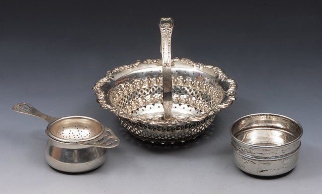 Appraisal: A SILVER SWEETMEAT BASKET with pierced and pressed scroll and