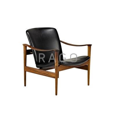 Appraisal: DANISH Lounge chair s Rosewood brass and leather Unmarked x