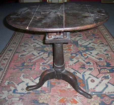 Appraisal: A George II oak tripod table with bird cage action