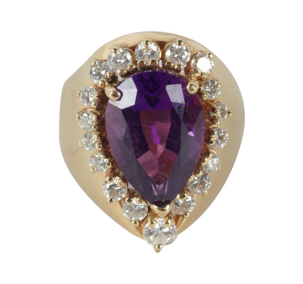 Appraisal: KARAT YELLOW GOLD AMETHYST DIAMOND RINGcentering one pear-shape amethyst weighing