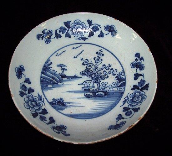 Appraisal: An th Century Bristol saucer shaped dish painted a lake