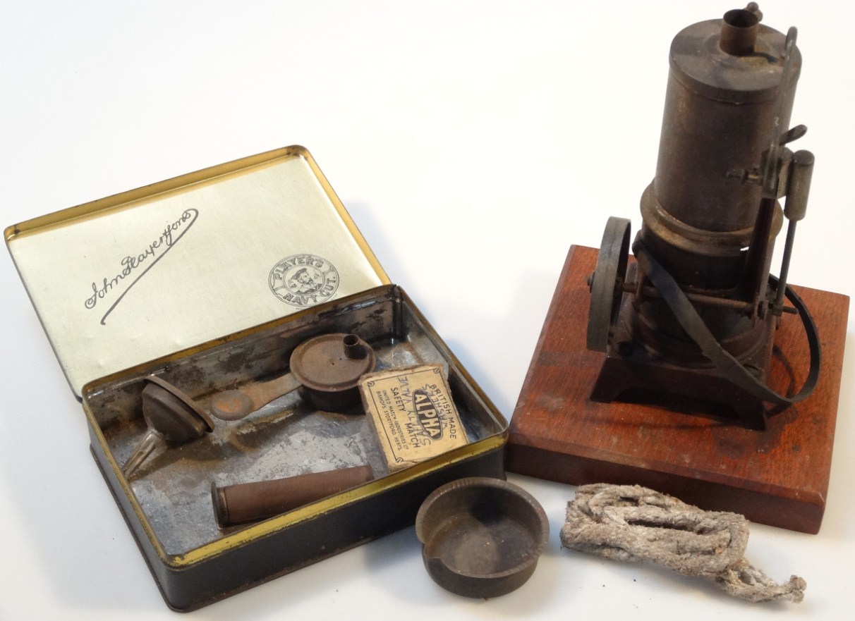 Appraisal: An early thC part stationary engine with a cylindrical top