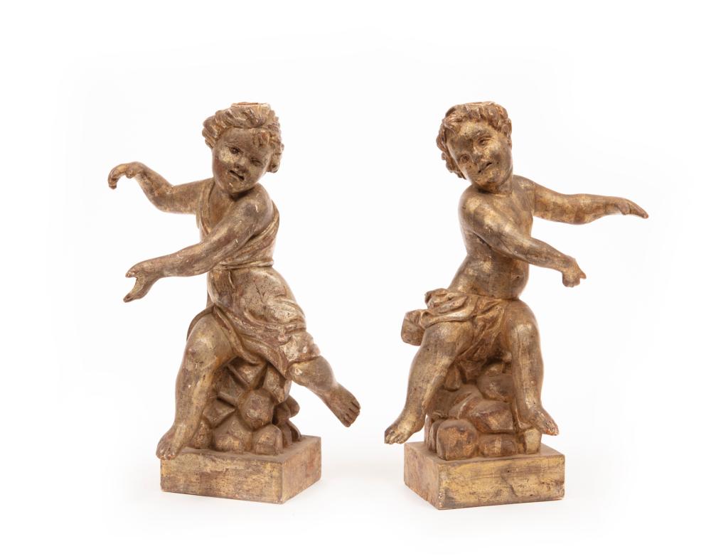 Appraisal: Pair of Italian Carved and Silvered Wood Putti opposing figures