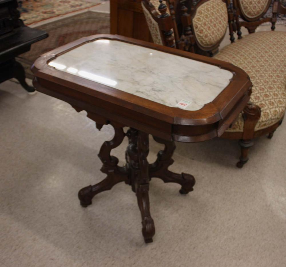 Appraisal: A VICTORIAN MARBLE-TOP WALNUT LAMP TABLE Renaissance Revival design American