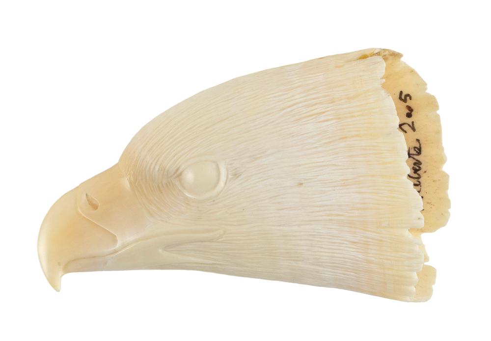 Appraisal: WHALE'S TOOTH RELIEF-CARVED IN THE FORM OF AN EAGLE'S HEAD