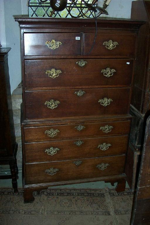 Appraisal: A small Georgian oak chest-on-chest fitted with an arrangement of