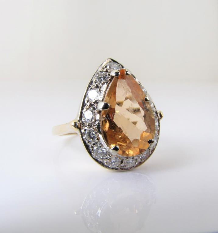 Appraisal: A K yellow gold ring with a center pear shape