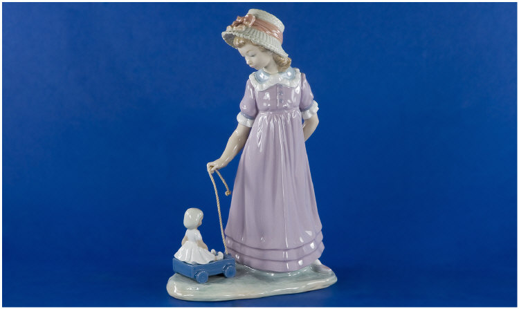 Appraisal: Lladro Figure Girl Pulling a Toy Cart with Doll Daisa