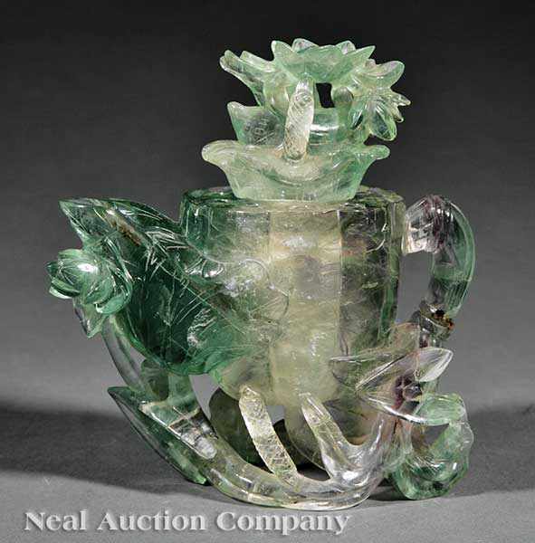 Appraisal: A Chinese Lotus Form Covered Pouring Vessel carved flourite or