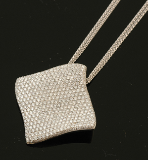 Appraisal: A diamond pendant by Charles Garnier Paris The pave set