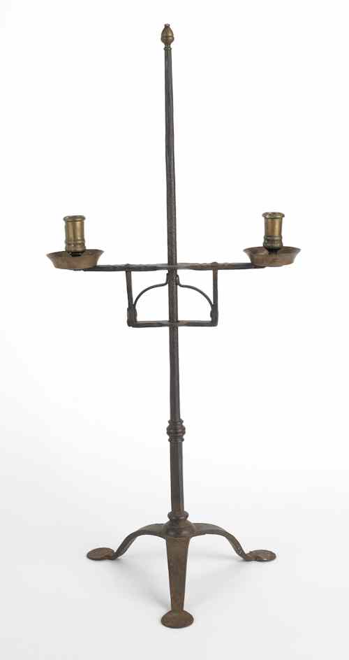 Appraisal: Wrought iron and brass adjustable table top candleholder with two