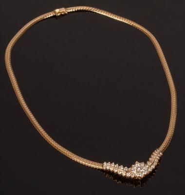 Appraisal: A diamond and k gold necklace centred by a flowerhead