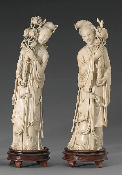 Appraisal: A pair of carved ivory beauties th Century Each standing